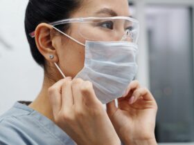Photo Of Woman Wearing Protective Goggles And Mask